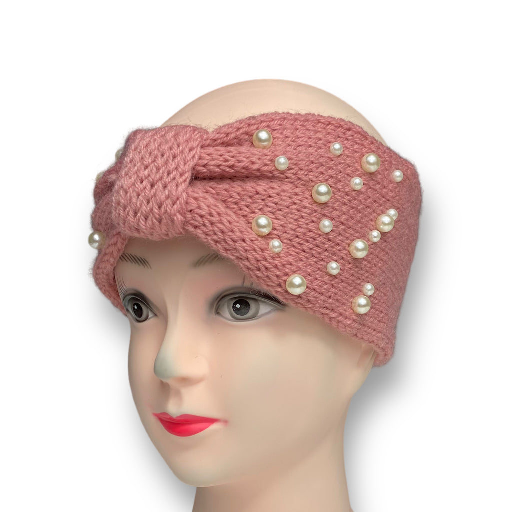 Close-up of a women's pink knitted winter ear warmer headband with pearl beads, perfect for keeping warm and stylish in cold weather.