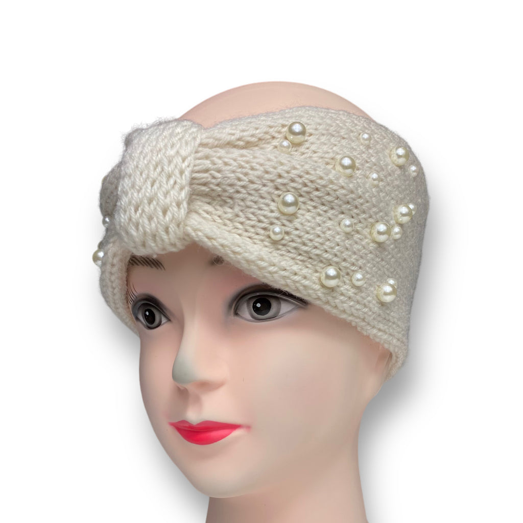 Close-up of a women's winter knitted turban headband with pearl beads, perfect as a warm and stylish ear warmer or hair accessory for cold weather.