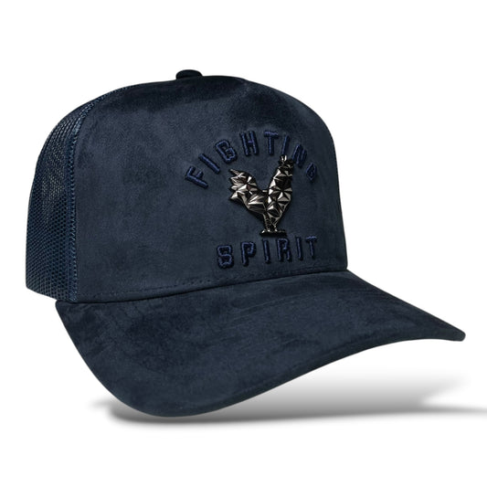 Navy blue trucker hat with a metal rooster emblem and “Fighting Spirit” embroidery on the front, featuring a suede panel and mesh back.