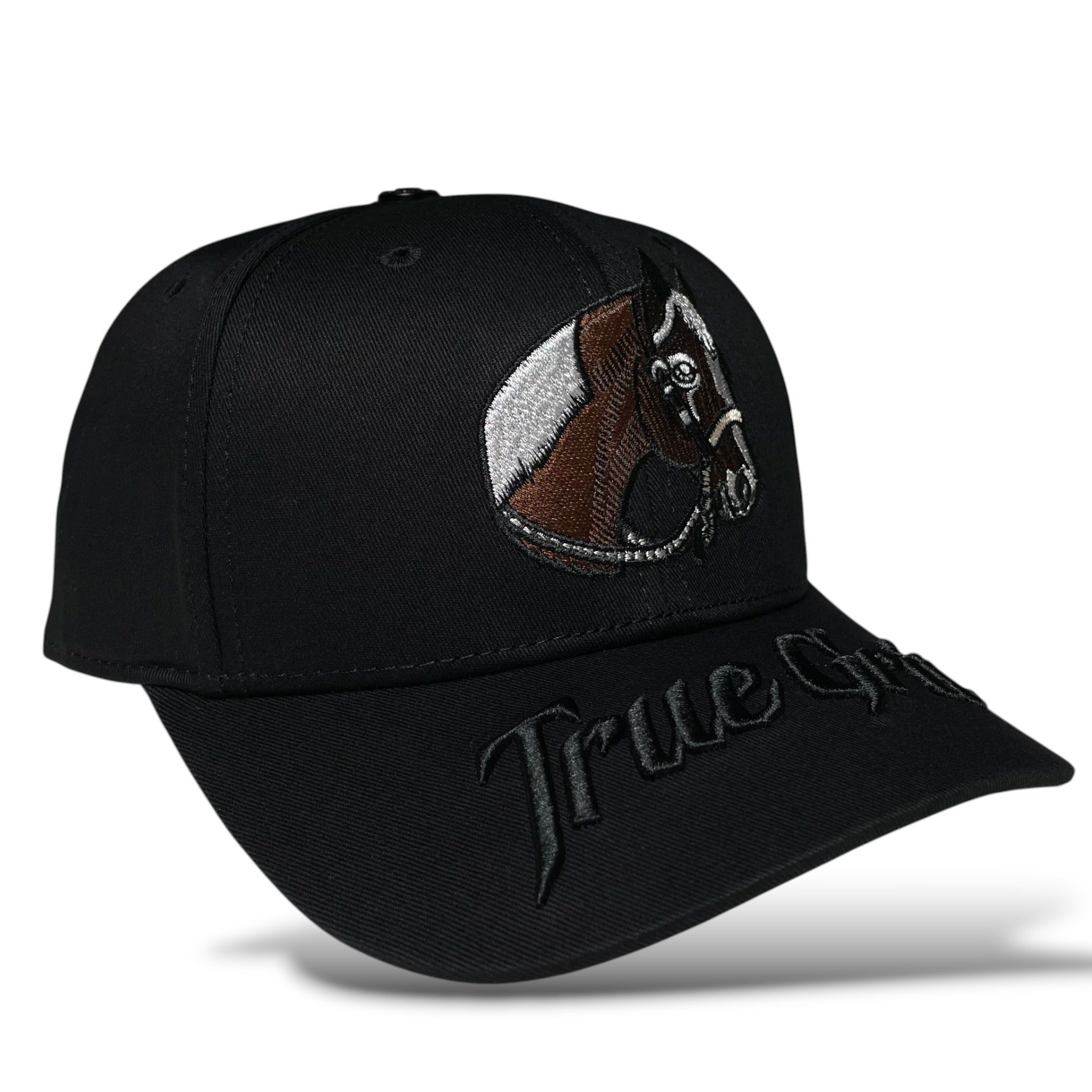 Black baseball hat featuring a 3D “TRUE GRIT” embroidered text, a horse design, and a horseshoe emblem.