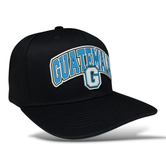 Black snapback baseball cap with a 3D rubber Guatemala patch on the front panel.