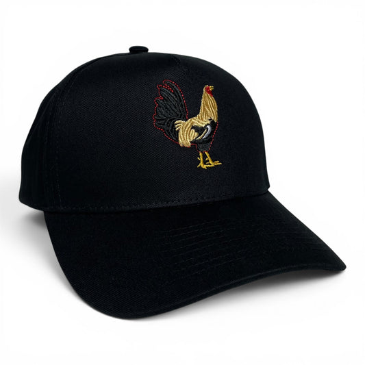 A black baseball cap featuring an embroidered rooster design on the front panel. The rooster embroidery is detailed with gold, black, and red threads.