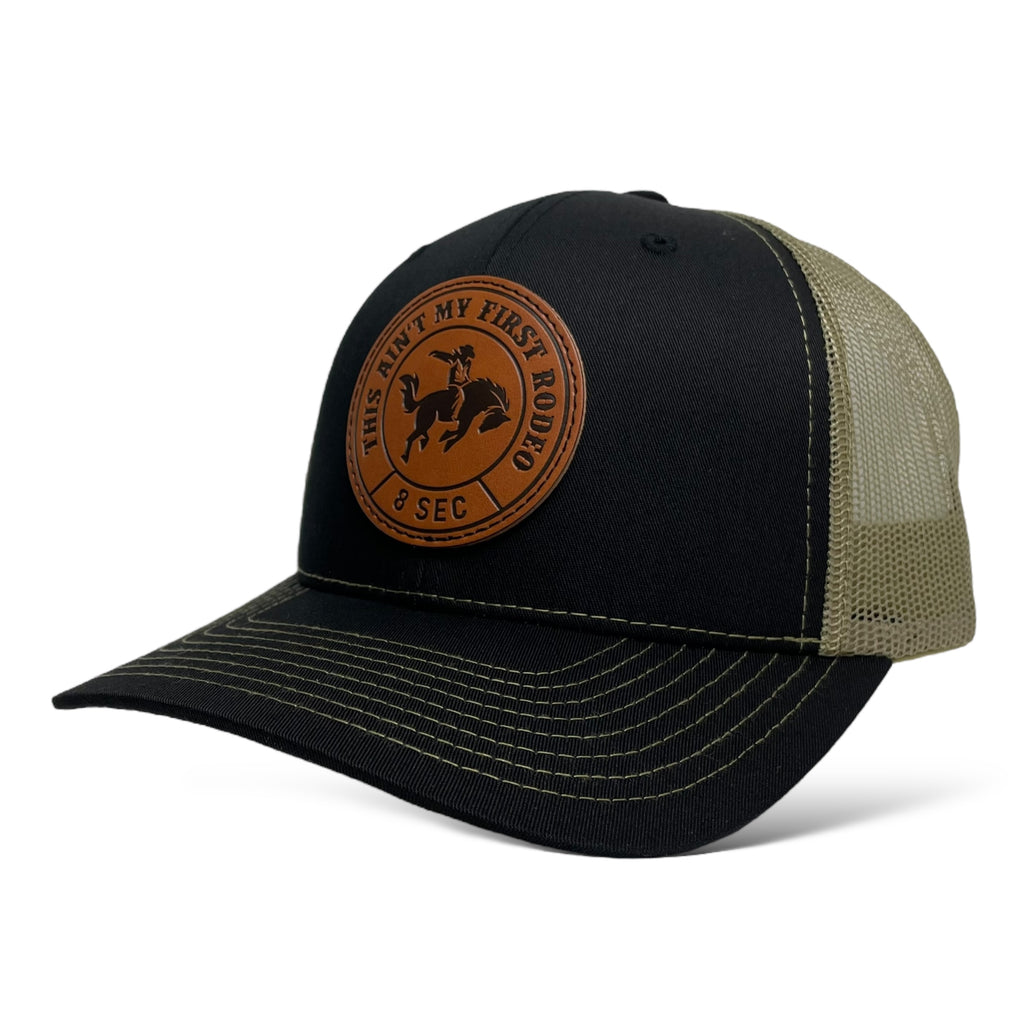 Black Trucker Cap with Mesh Back and Leather Bucking Bronco Patch