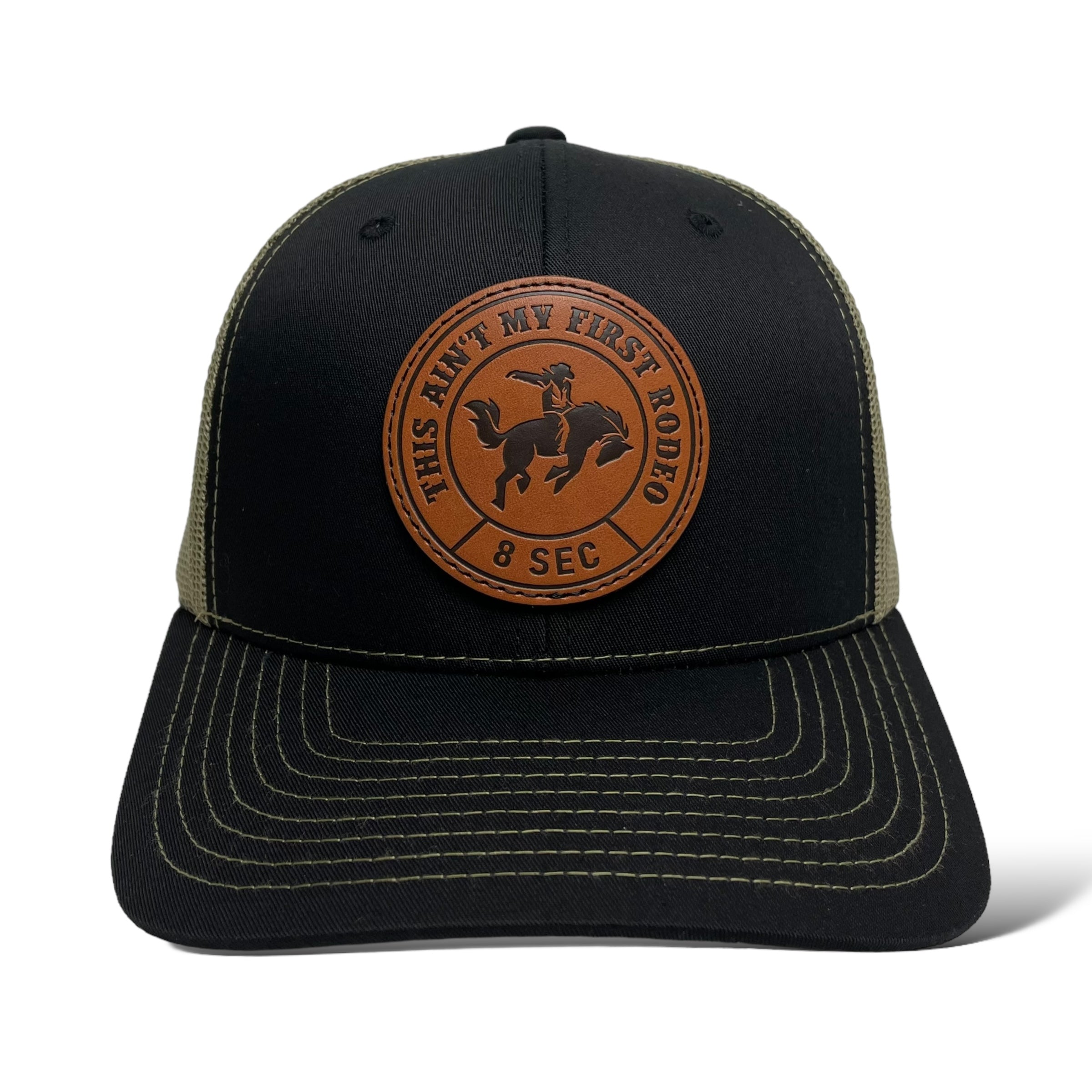 Close-up of Leather Bucking Bronco Patch on Black Trucker Cap