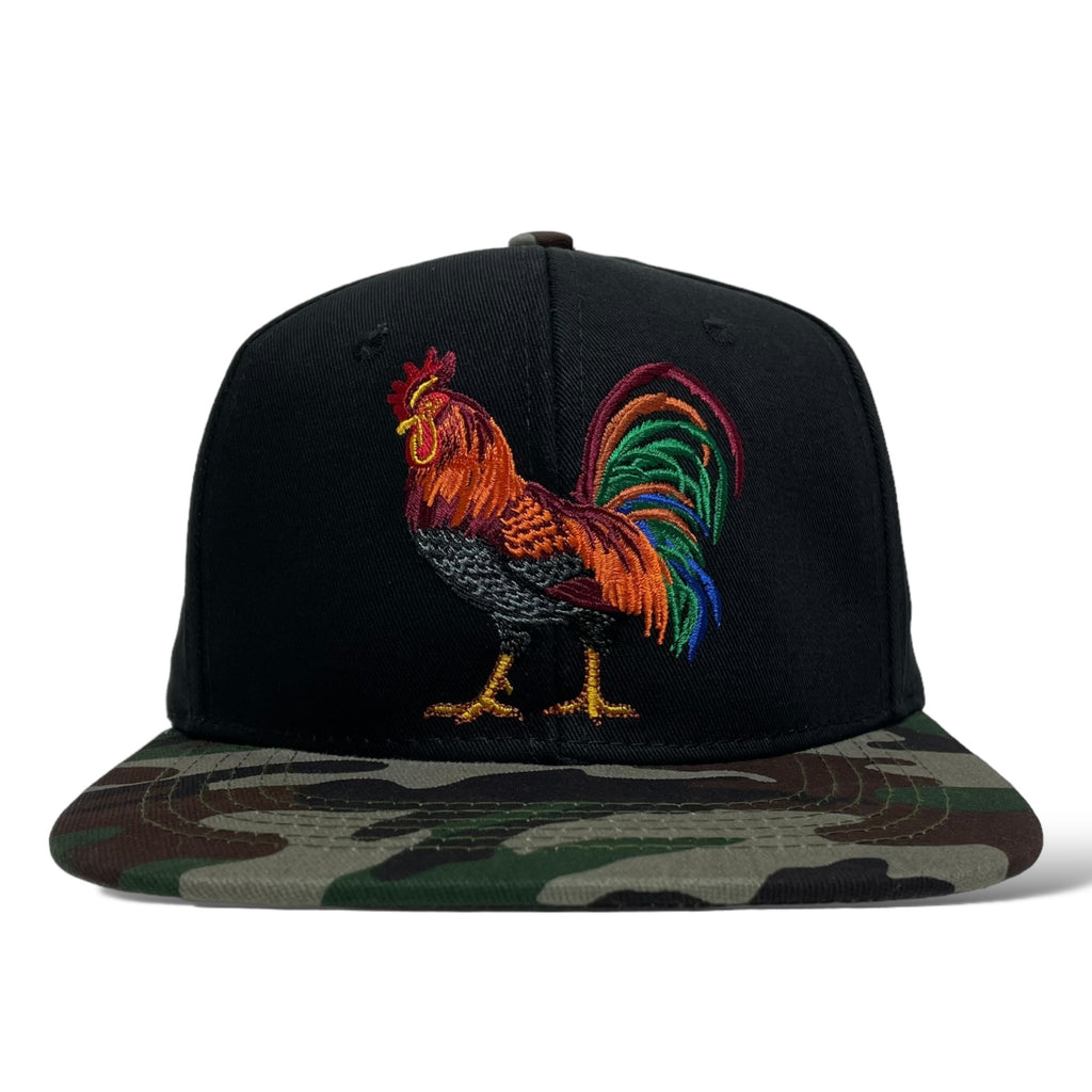 Close-up of rooster embroidery on black camouflage snapback cap