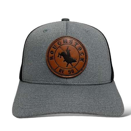 Close-up of leather bucking bull patch on gray snapback trucker hat