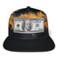 Black snapback cap with 100 dollar bill embroidered patch on the front, flat brim, adjustable closure, streetwear style.