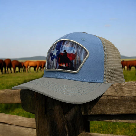 Multi-color snapback trucker hat with cowboy riding a horse and Texas flag patch