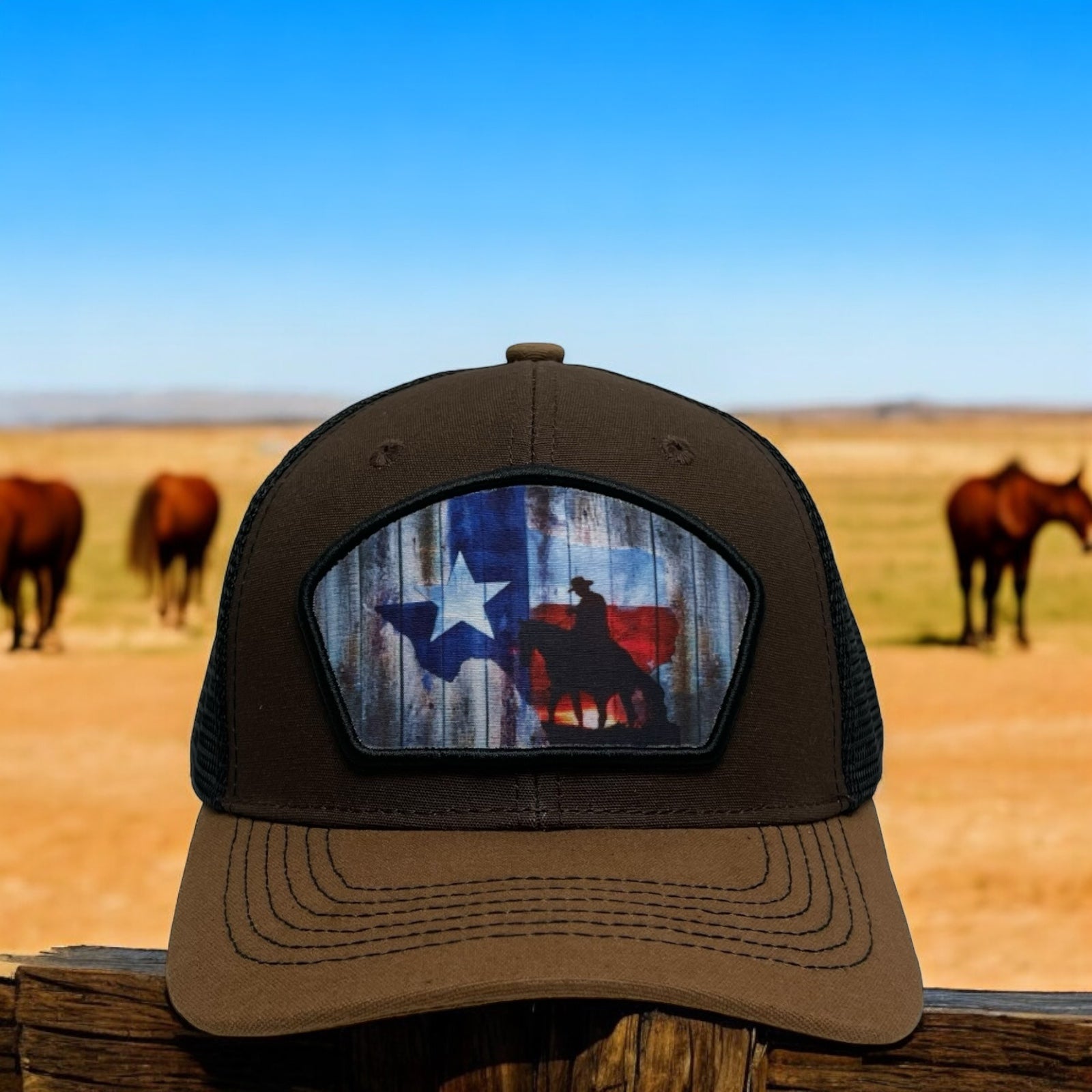 Brown snapback trucker hat with cowboy riding a horse and Texas flag patch