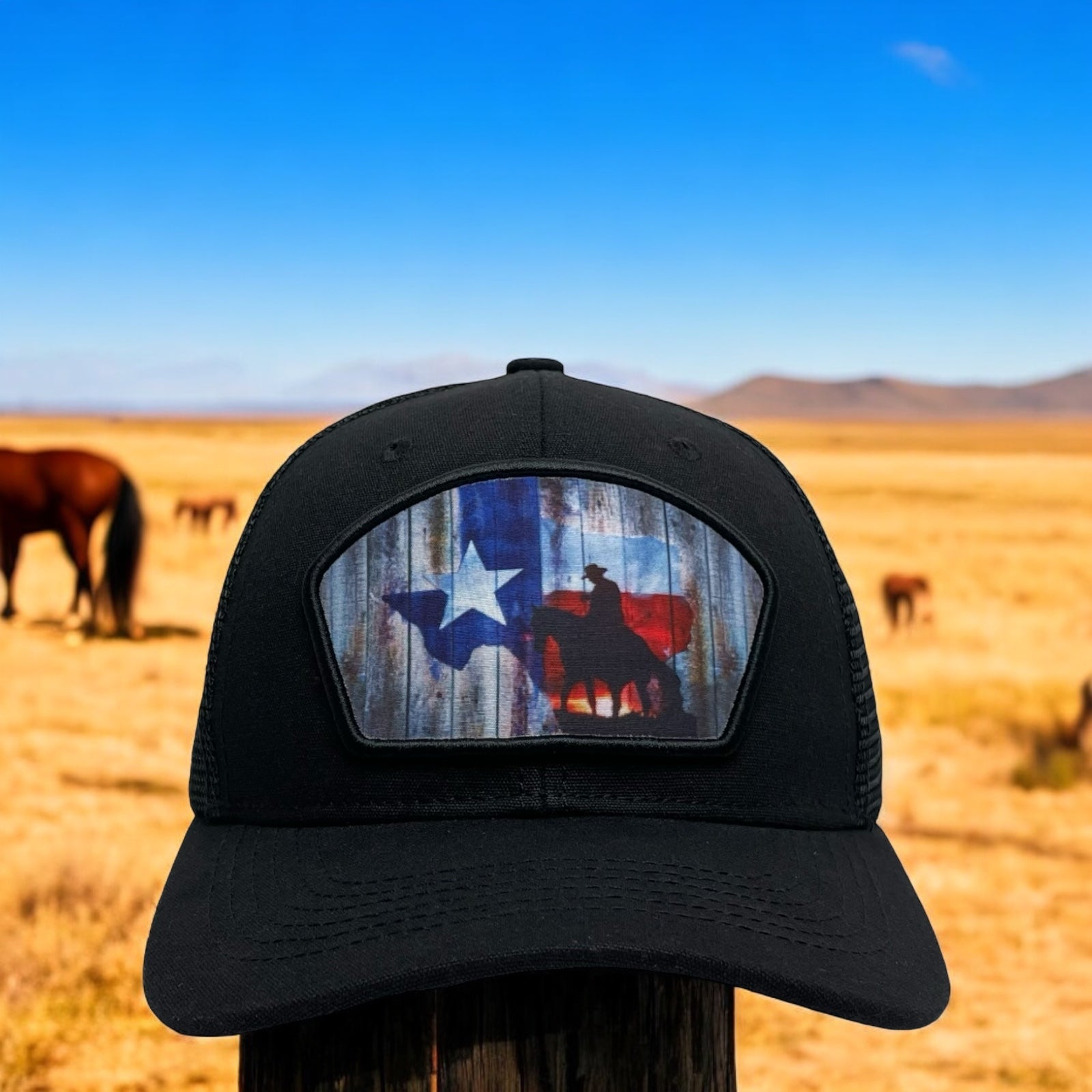 Black snapback trucker hat with cowboy riding a horse and Texas flag patch