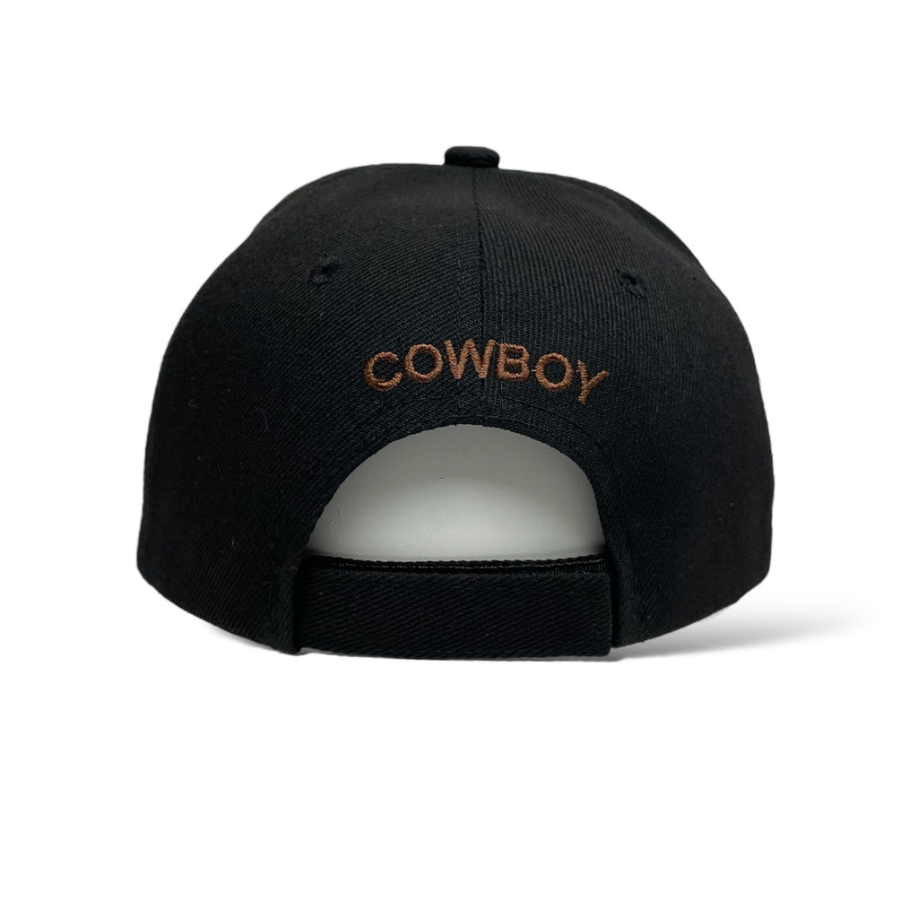 Close-up of black baseball cap showing 'Cowboy Ride Hard' and bull rider embroidery